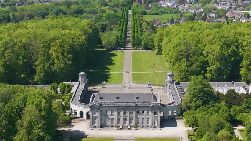 main part château seneffe green parks behind visitors walking toward building create lively scene left to right front pans aerial drone of de belgium