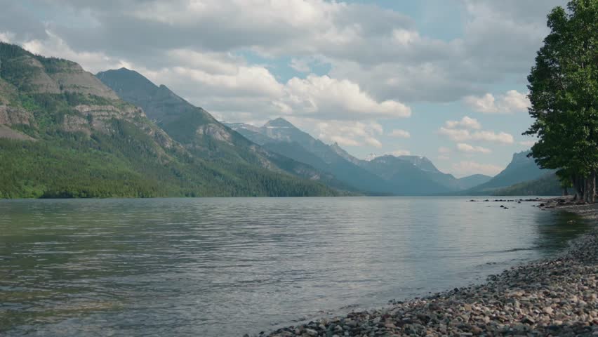 Amazing lake view at Waterton Lakes National Park Shoreline Under a Cloudy Sky