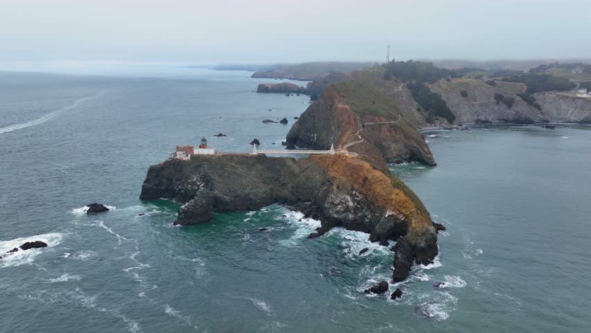 Point Bonita Lighthouse in cloudy day with fog at Point Bonita at San Francisco Bay in Marin Headlands in Marin County, California CA, USA. This lighthouse is in Golden Gate National Recreation Area. 