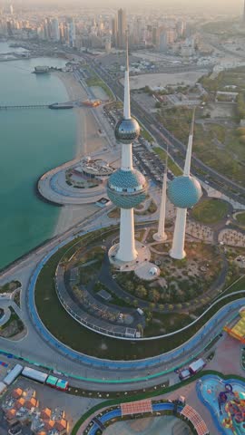 Stunning vertical drone shot of Kuwait Towers, beach, and skyline—perfect for travel, architecture, and editorial content.