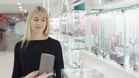 Discovering exquisite jewelry selections in a stylish store with captivating slow motion effects - Powered by Shutterstock - Get 15% off with code: PIKWIZARD15