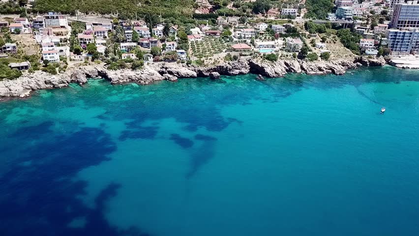 A drone video from the Mediterranean Sea on the coastline with the view of hotels apartments and resorts of Dobra Voda in Montenegro