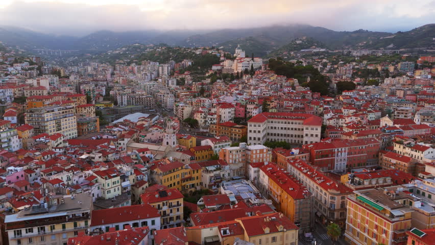 Cityscape view of Liguria, Italy, showcasing colorful rooftops and Mediterranean surroundings