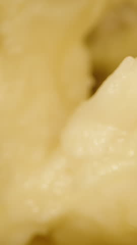 Dolly Slider Close Up of Spiky Outer Shells of Multiple Durians Opened with Yellow Flesh Visible in Between under Black Background, Exotic Fruit Display Concept.