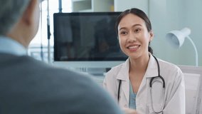Female doctor examines patient using stethoscope in medical clinic. Professional nurse comforts elderly patients with compassionate care. Asian female caregiver provides personal support for senior  - Powered by Shutterstock - Get 15% off with code: PIKWIZARD15