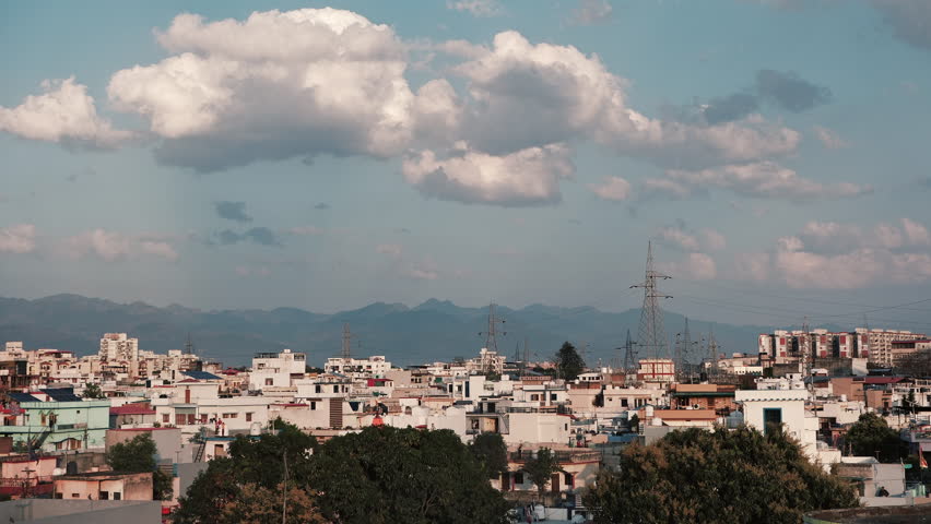 Digital network overlay across an Indian city. Blue lines symbolize data flow, wireless communication, and smart city connectivity over urban buildings and infrastructure. - Powered by Shutterstock - Get 15% off with code: PIKWIZARD15