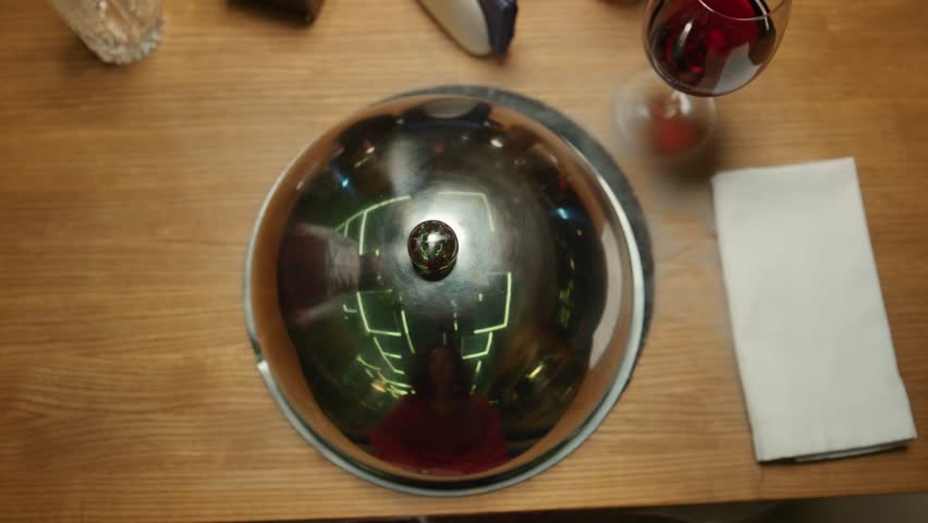 Overhead: Silver Cloche Lifts to Reveal Gourmet Chocolate Dessert with Dry Ice Smoke. Fine Dining Restaurant Experience.