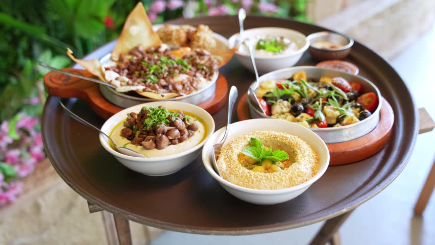 Vibrant Middle Eastern mezze platter served on a tray—ideal for restaurant, cultural cuisine, or outdoor dining visuals.