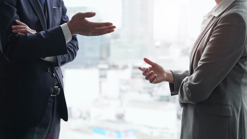 Group of business people having a conversation in an office