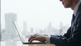 Male business person using laptop computer in urban office building - Powered by Shutterstock - Get 15% off with code: PIKWIZARD15