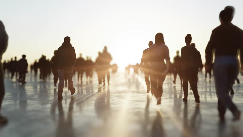 Large group of people walks toward a glowing sunset, casting long shadows. 3d render