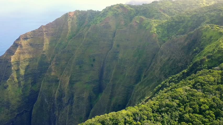 Stunning 4K aerial drone footage of a tropical island and clear turquoise water, under a sunny blue sky. Perfect for travel promos, island tourism, and nature documentaries.