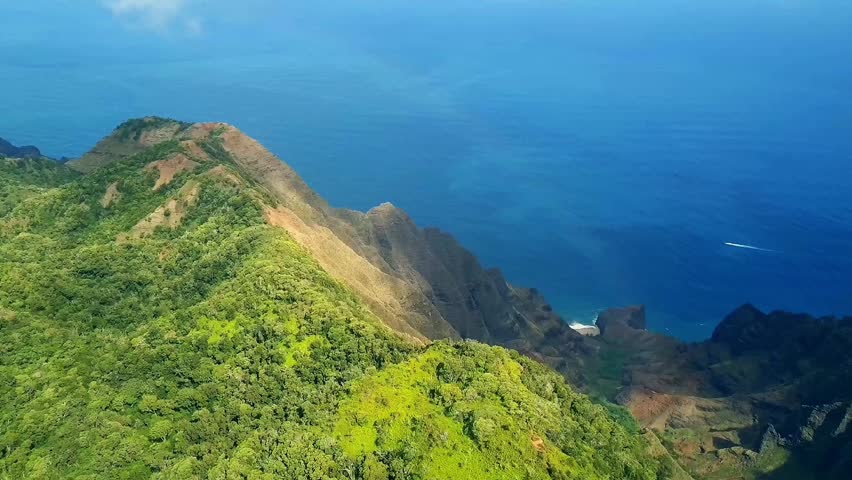 Stunning 4K aerial drone footage of a tropical island and clear turquoise water, under a sunny blue sky. Perfect for travel promos, island tourism, and nature documentaries.