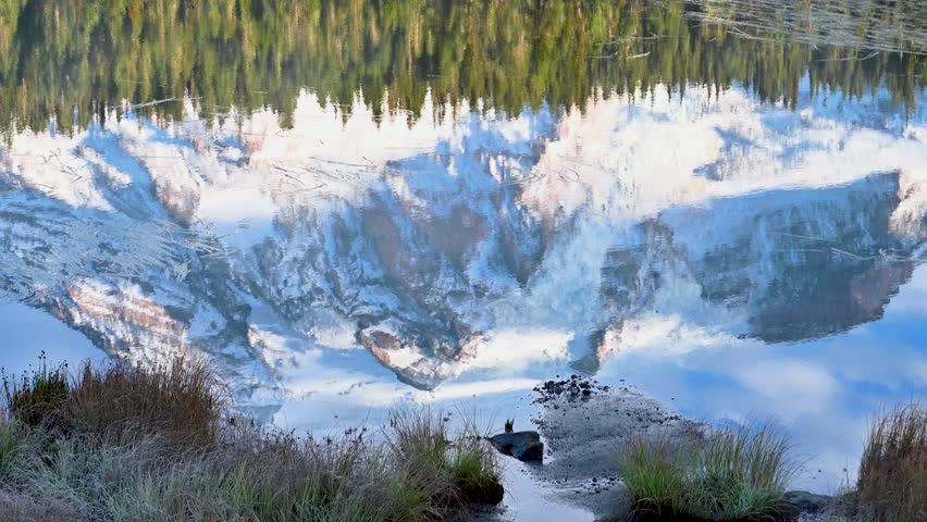 Mount Rainier in reflection lake at morning golden hour