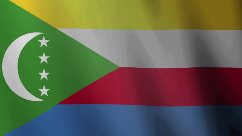 Waving flag of Comoros with green triangle four white stars and yellow white red blue stripes suitable for use in African or island contexts