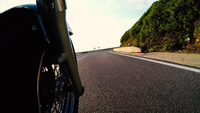 Classic motorcycle ride seen from the front wheel