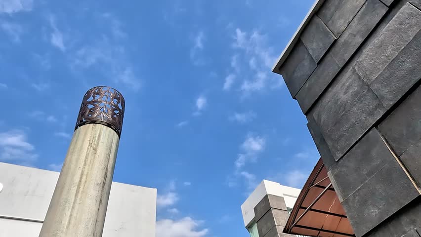 Modern building with blue sky background. Background for project or quotes.