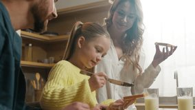 Happy smile Caucasian family together at kitchen at home parents with child kid daughter preparing cook breakfast eating chocolate sandwich mother father little girl organic food supermarket delivery - Powered by Shutterstock - Get 15% off with code: PIKWIZARD15