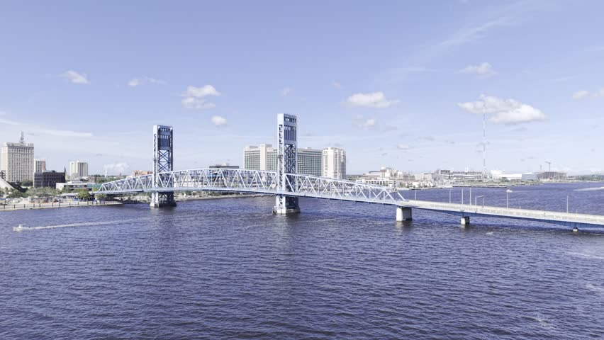 Aerial view of the Main Street Bridge over the St. Johns River with sleek skyscrapers lining the cityscape, Jacksonville, Florida, United States.