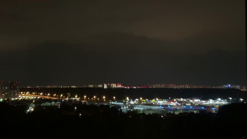 Stormy night. Lightning strikes near  house. Night sky dark, full of powerful lightning.  Rural setting. Nature scene. Home safety. Weather emergency. Thunderstorm danger.time lapse clouds over city