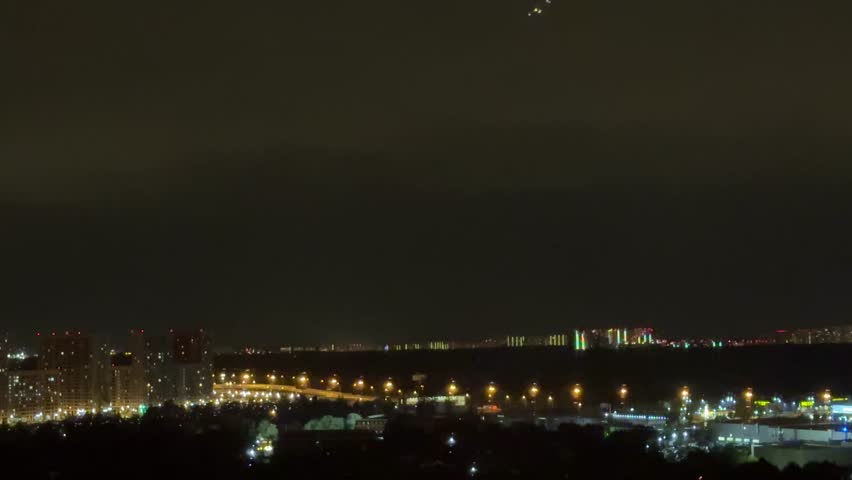 Stormy night. Lightning strikes near  house. Night sky dark, full of powerful lightning.  Rural setting. Nature scene. Home safety. Weather emergency. Thunderstorm danger.time lapse clouds over city