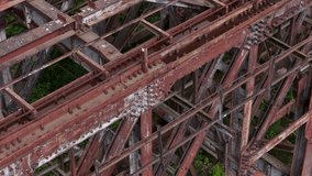 Close-Up of Corroded Steel Truss Structure on Abandoned Railway Bridge - Powered by Shutterstock - Get 15% off with code: PIKWIZARD15