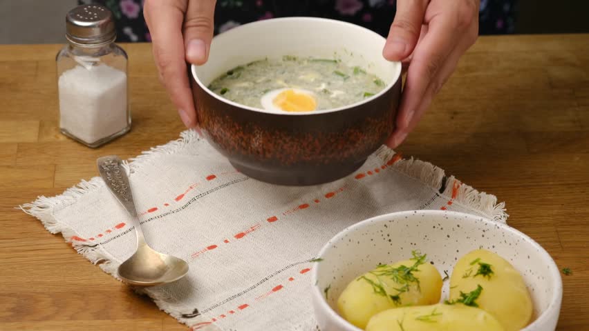 Step-by-step preparation of cold sorrel soup on a wooden kitchen table. Video recipes. Step-by-step recipes. Belarusian cuisine