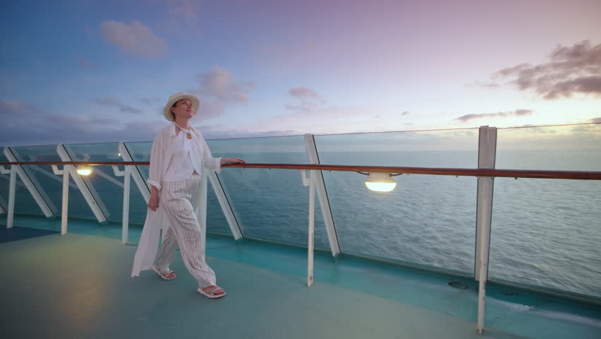 Enjoy a serene moment on a cruise ship at sunset, taking in the stunning ocean views as a stylishly dressed person strolls the deck, savoring the refreshing breeze and peaceful ambiance
