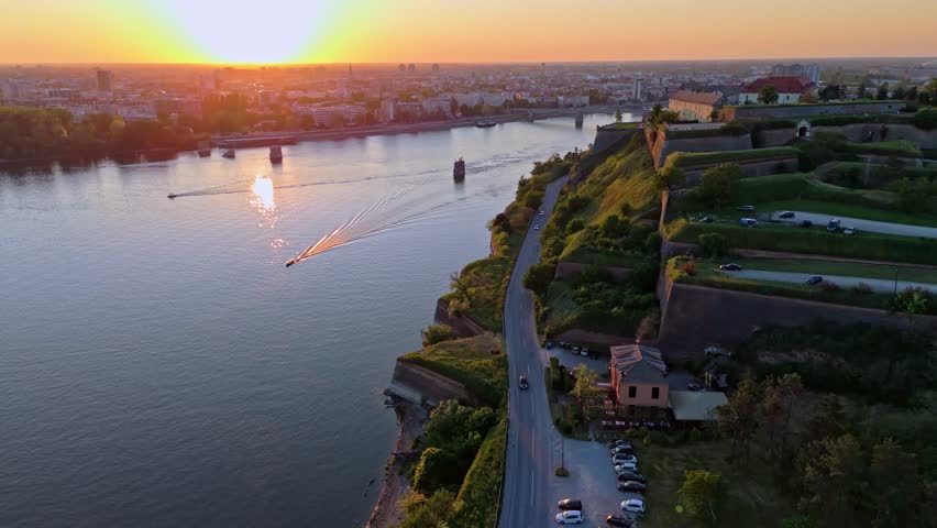 Sunset over the Danube River near Petrovaradin Fortress in Novi Sad Serbia with boats and beautiful scenery