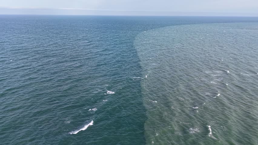 Confluence where two bodies of water (sea and river) meet but do not mix