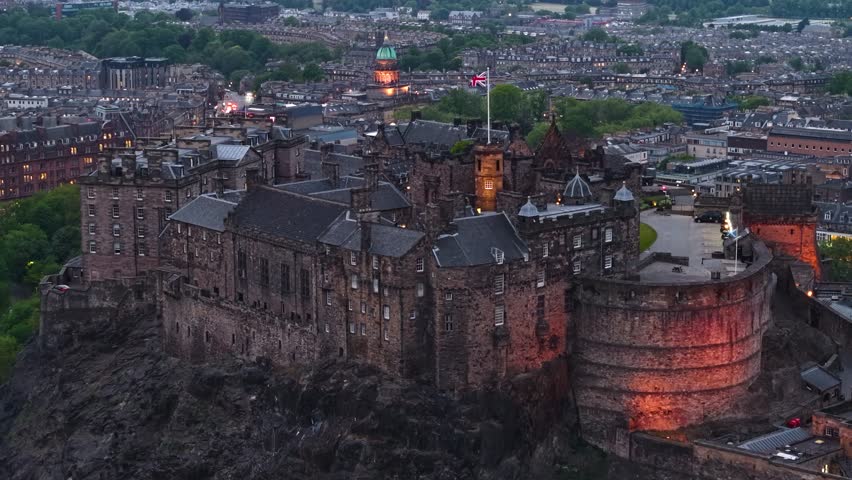Night aerial footage of Edinburgh Castle in Scotland, United Kingdom