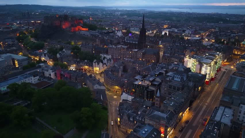 Night drone shot of Edinburgh city center, Scotland, United Kingdom