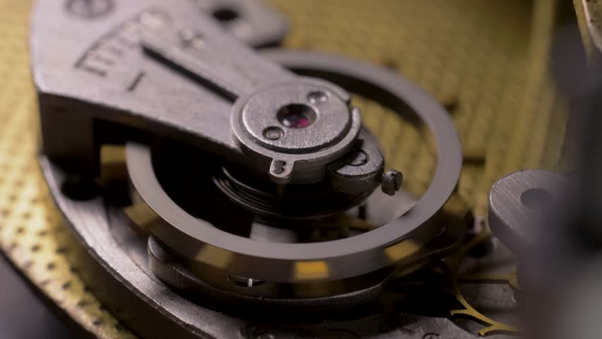 Cog wheels works in clockwork mechanical watch. Time or work concept. Mechanism details and watches parts, precise measuring