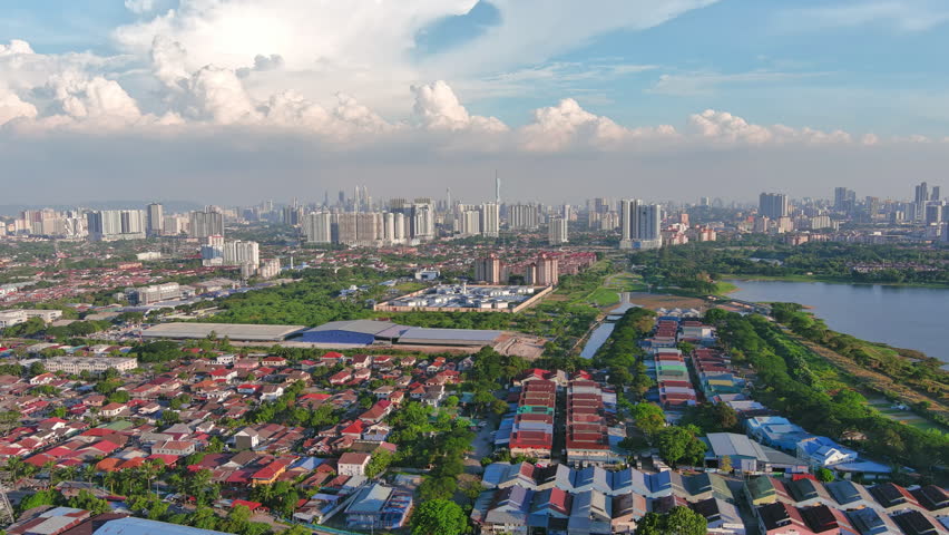 Kuala Lumpur, Malaysia: Aerial view of capital city of Malaysia, modern skyline on sunny day, perfect for travel, business, or development projects - landscape panorama of Southeast Asia from above