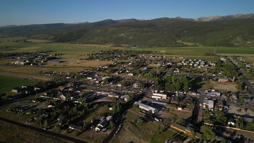 Aerial above mountain town of Victor Idaho in summertime