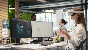 Female technician wearing VR goggles coding with AI language model assistance in startup office. Young woman using virtual reality integrating LLM assistant suggestions into code editor, camera A - Powered by Shutterstock - Get 15% off with code: PIKWIZARD15