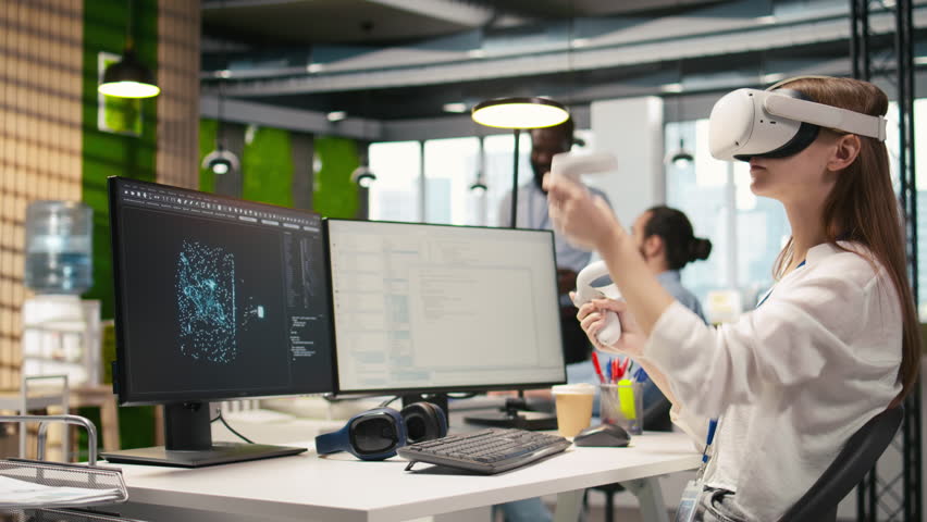 Female technician wearing VR goggles coding with AI language model assistance in startup office. Young woman using virtual reality integrating LLM assistant suggestions into code editor, camera A - Powered by Shutterstock - Get 15% off with code: PIKWIZARD15