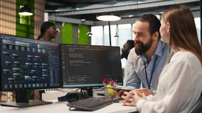 Mentor teaching young employee to troubleshoot software errors using AI. Manager doing induction to newcomer junior dev using computer to write code, developing machine learning APIs, camera A - Powered by Shutterstock - Get 15% off with code: PIKWIZARD15