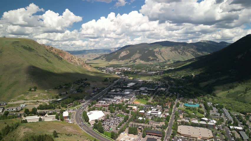 High aerial of mountain town of Jackson Wyoming in summer in Tetons