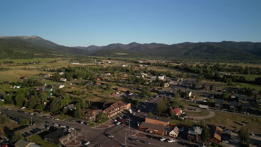 Low aerial above main street in Victor Idaho in summer in Teton Mountains