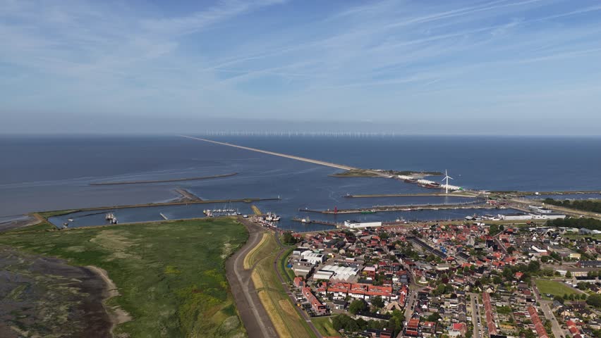 The Afsluitdijk, viewed from Enkhuizen, flood defence in the Netherlands, between North Holland and Friesland, separating the IJsselmeer from the Wadden Sea. Aerial video
