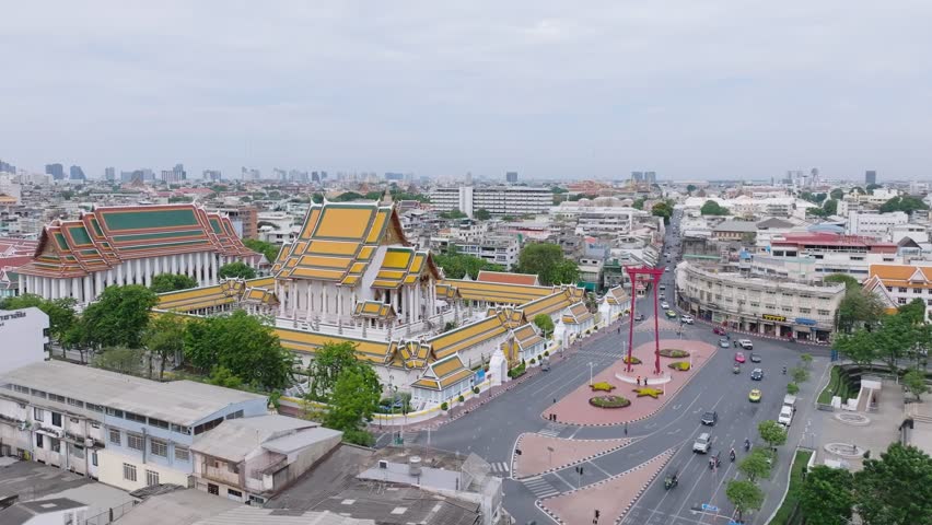 Aerial View of Bangkok’s Giant Swing and Wat Suthat Surrounded by Urban Skyline