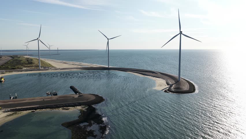 Wind turbines at Delta works, Neeltje Jans, Zeeland, The Netherlands. Renewable energy. Aerial drone video