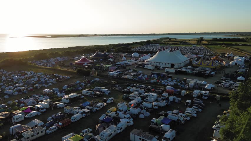 Drone shot of "chauffer dans la noirceur" music festival in normandy