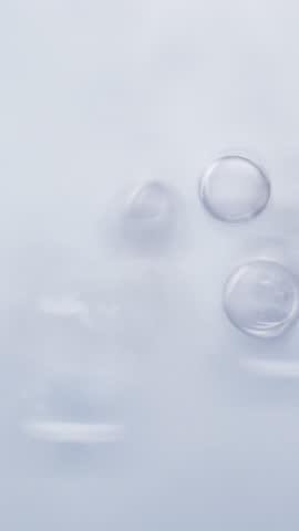 Skincare technology with molecular hydration and smooth serum texture. Clean, modern, elegant design shows beauty, glow, and advanced cosmetic innovation. Vertical format. 3d animation
