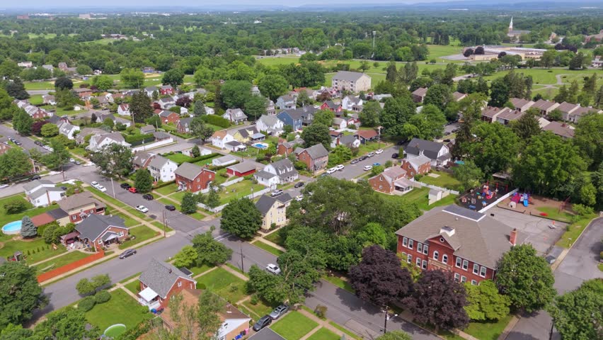 Aerial orbit low rising suburb in Bethlehem Pennsylvania USA, daytime