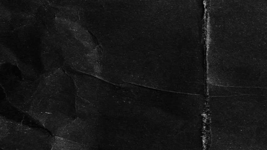 Folded black paper animation. A dark, gritty stop-motion loop with a raw, mysterious, textured background.Dark grunge texture loop. A flickering animation of old