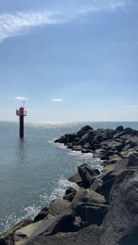 View to beautiful North Sea, landscape with beach and sand dunes, North sea coast landscape Jutland Denmark. Beach and sand dunes and sea. Beautiful natural beach in northern Denmark. The waves. Calm