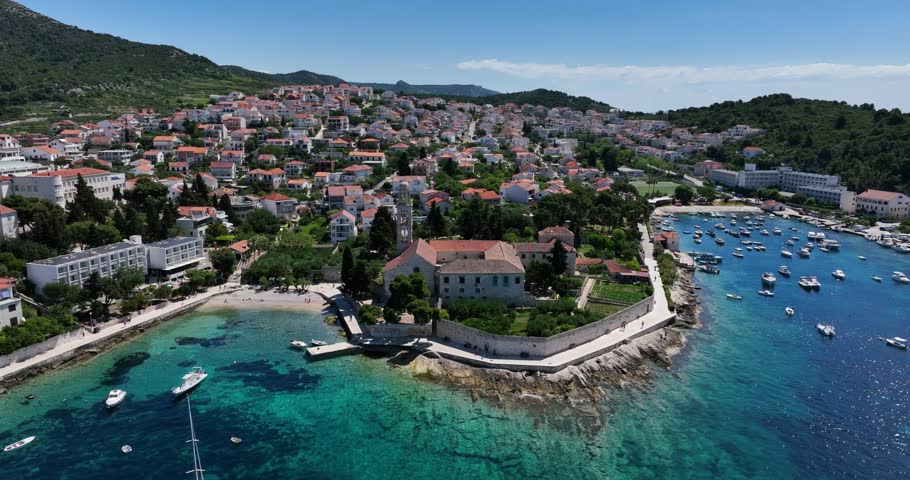 Port And Resort Town On The Croatian Island Of Hvar. Aerial Drone Shot