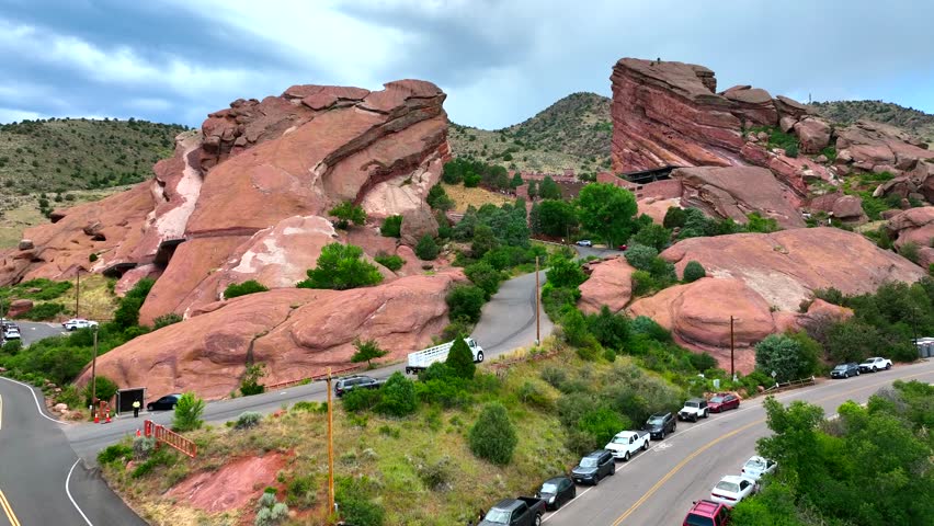Slow Aerial Drone Rise revealing landscape of Red Rocks Amphitheater near Denver Colorado In the summer